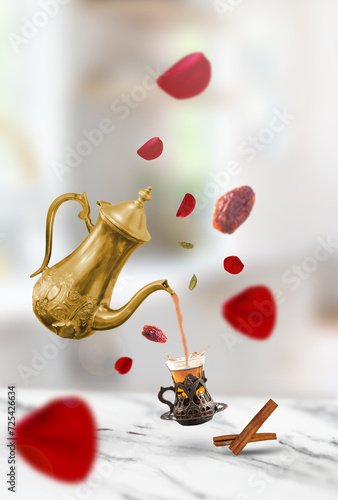  creative idea-Arabic teapot traditional pours tea into a cup-Levitation concept-flying rose petals with date fruit and cinnamon