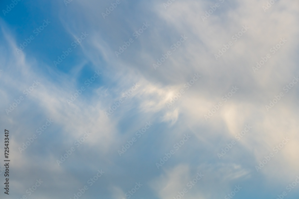 Blue sky with white soft wispy high clouds Blue sky with white soft wispy high clouds