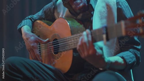 Guitarist playing Spanish guitar at a concert