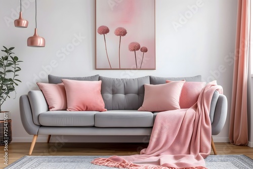 Experience modern interior design with a chic grey sofa accented by vibrant pink pillows and a blanket  complemented by abstract art on a white wall.