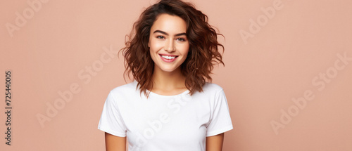 Young happy woman, smiling gen z girl model wearing tshirt looking at camera standing on color background. Face skin care cosmetics makeup, fashion ads. Beauty portrait. White t-shirt mock up template