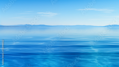 Expansive View of a Calm Blue Ocean Meeting the Sky at the Horizon, Emphasizing Tranquility and Depth