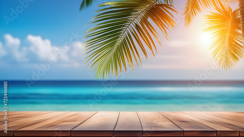 top of wood table with seascape and palm leaves blur bokeh light of calm sea and sky at tropical