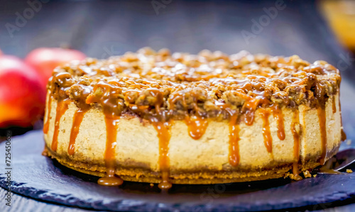 Cheesecake with Caramel Apple on plate, close up, decorated, minimal. Homemade apple cheesecake. For birthday, party, pastry confectionery advert