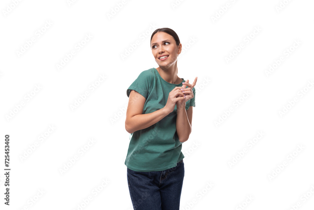 attractive young caucasian woman with black hair in a t-shirt smiling on a white background