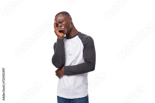 portrait of a young kind shy American guy with a short haircut dressed in a long-sleeve sweater