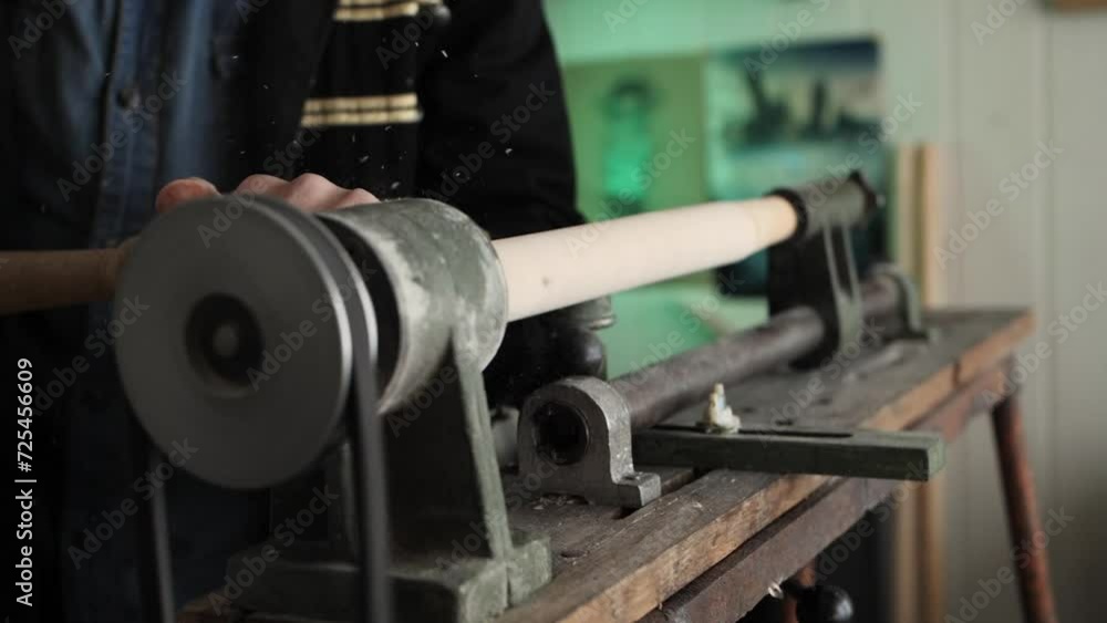 The carpenter's hands carve the product from wood The carpenter's hands carve the product from wood