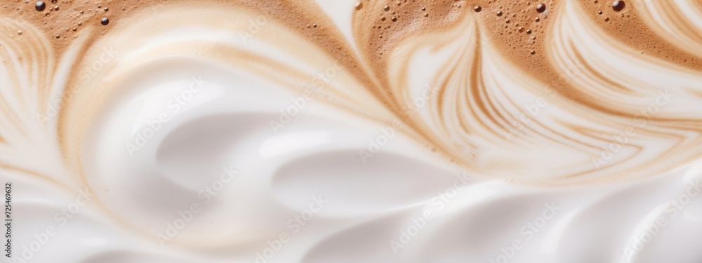 A close-up of the surface of a latte mixed with coffee and milk to be used as a banner. - obrazy, fototapety, plakaty 