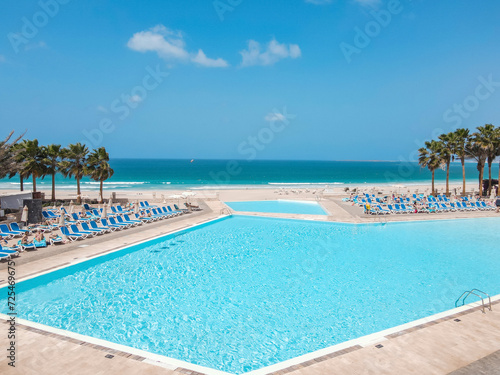 Fototapeta Naklejka Na Ścianę i Meble -  Swimming pool by the beach in Boa Vista Island Cabo Verde