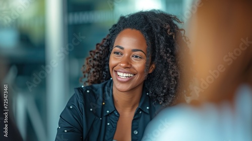 Happy business woman talking to her colleague in a meeting by Canon EOS 5D Mark IV DSLR in High - Resolution 8K --ar 16:9 --style raw --v 6 Job ID: f0a0c648-b92a-4bd2-826b-e3c29d3764bd photo