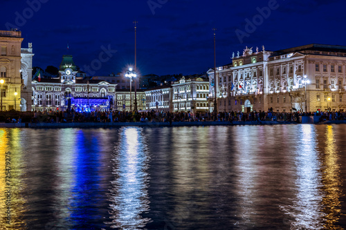 Dusk and night in Trieste. Between historic buildings and the sea.