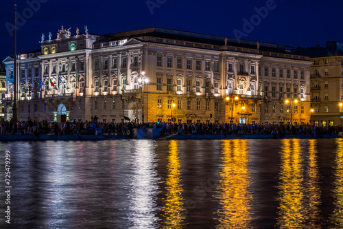 Dusk and night in Trieste. Between historic buildings and the sea.