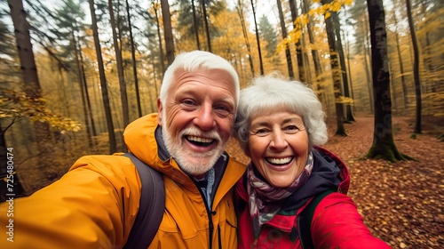 Autumn Forest Selfie: Stylish Elderly Couple in Bright Jackets