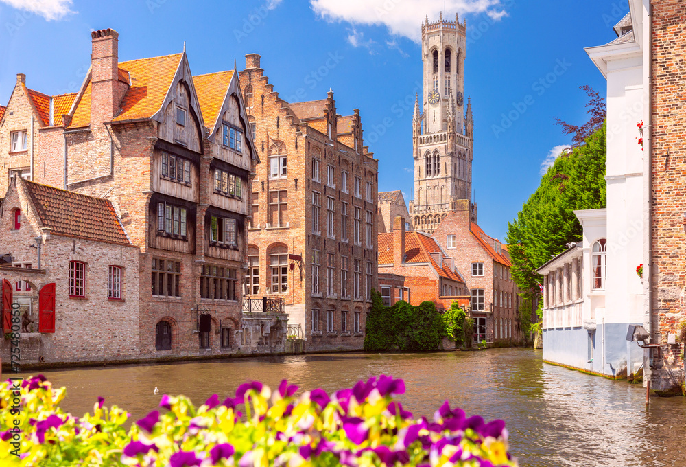 Obraz premium Scenic sunny medieval fairytale town and tower Belfort from the quay Rosary in Bruges, Belgium