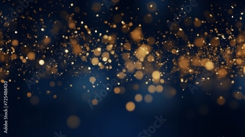 Golden christmas light bokeh on navy blue background: abstract dark blue and gold particle backdrop with festive glow