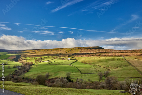 With Cowstone Gill, a view looking west across White Scar towards Wasset Fell from the single track road from West Burton to Walden photo