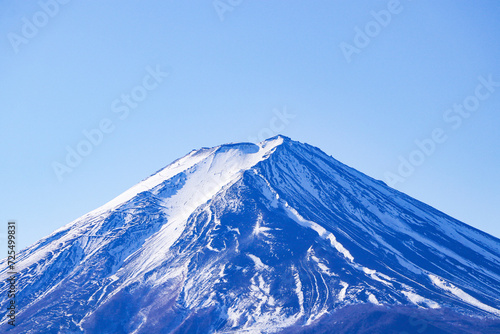 Mount Fuji world famous tourist attractions. Beautiful Fuji mountain with snow cover on top with Bright blue sky  bright sunlight is background at Japan. 