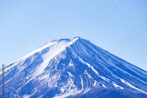 Mount Fuji. Beautiful Fuji mountain with snow cover on top with Bright blue sky  bright sunlight is background at Japan.