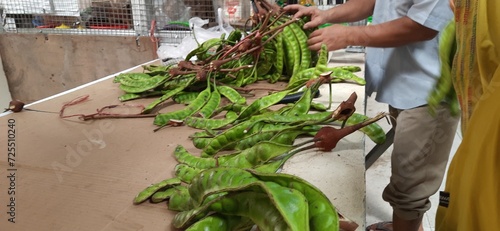 Fotografie Petai or Pete or Green stink bean (Parkia speciosa) is vegetable typical Indonesian food, bitter and foul-smelling nuts