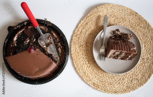 Top view of chocolate cake with chocolate cream on a plate