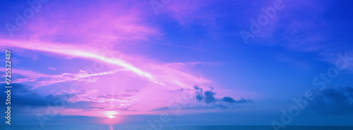 Early morning on the beach. Pink sunrise over the sea. Horizontal banner