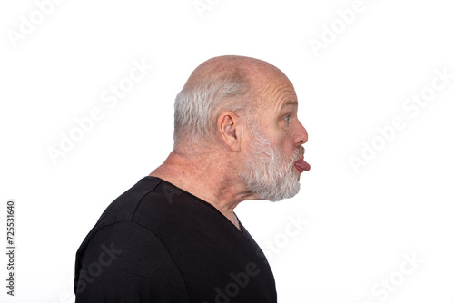 Profile Portrait, Middle-Aged Bearded Man in Black T-Shirt Sticking Out Tongue - Playful Humor on White Background