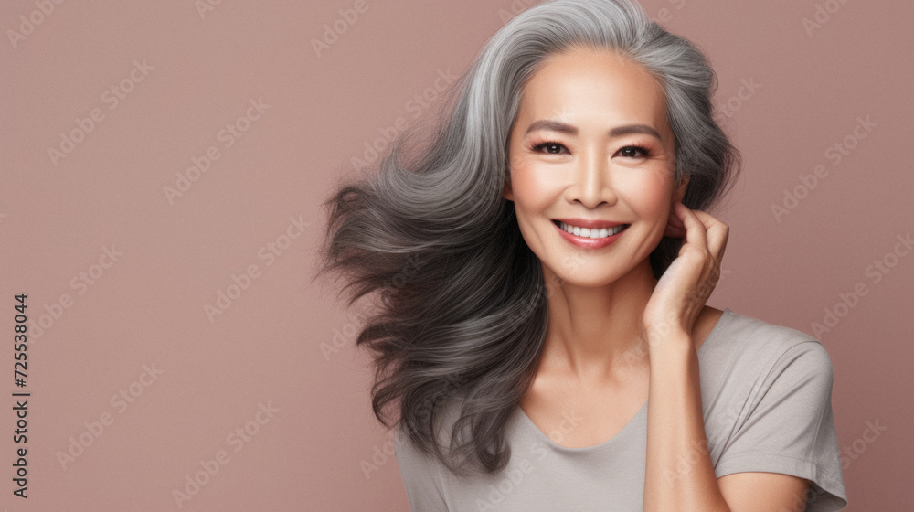 Beautiful asian woman with long healthy hair, on color background Beautiful asian woman with long healthy hair, on color background