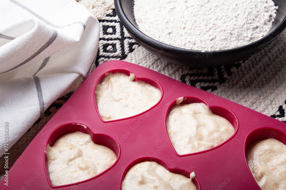 Heart-Shaped Muffins in Preparation close up Heart-Shaped Muffins in Preparation close up