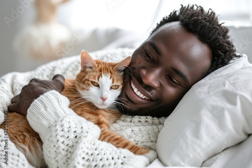 heartwarming embrace, joyful black man snuggling with her ginger cat in cozy, white bed, sharing moment of affection and comfort, pets lover owner. photo