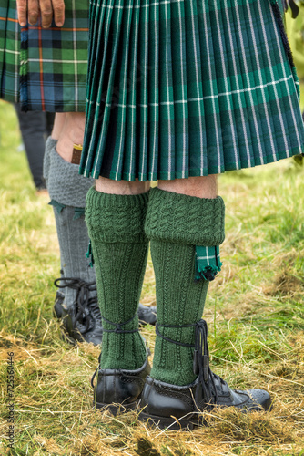 Traditional Highland dress with kilt, kilt socks, kilt sock flashes, Sgian Dubh knife and Scottish leather Ghillie Brogues kilt shoes photo