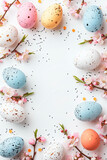 Easter eggs background with spring flowers and pastel blue background. Copy space