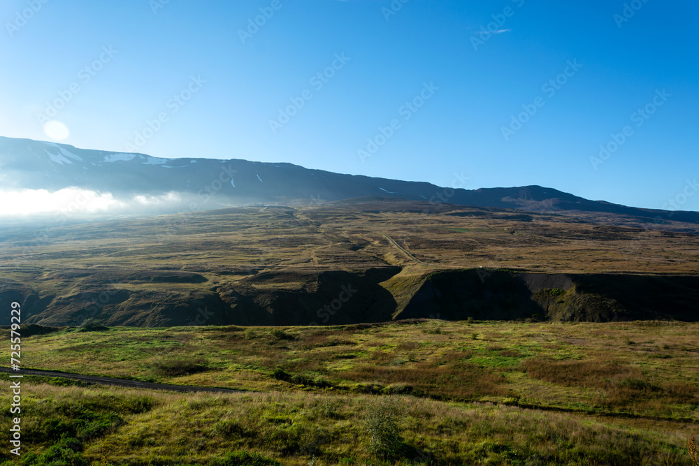 Fototapeta premium Mountain landscape with green grass and blue sky. Iceland, Europe.