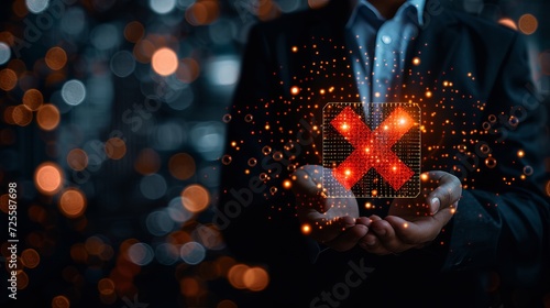 Businessman holding digital hologram of red x mark for failed certification or audit concept photo