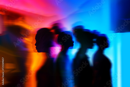 ADDICTIVE_AI Generated Image. Ghostly silhouettes of ethnic group of women in neon light