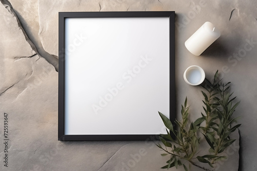 Moldura de quadro em branco com elementos como pedras e plantas verdes  photo