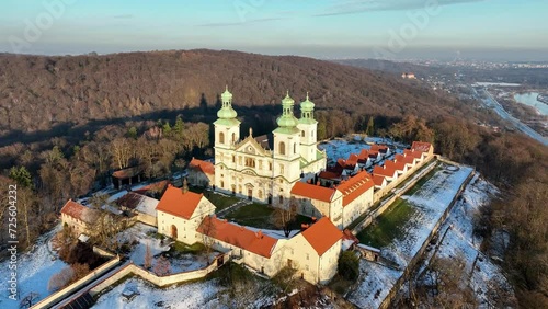 Camaldolese monastery and church in Bielany, Cracow, Poland
Camaldolese monastery and baroque church in the wood on the hill in Bielany, Krakow, Poland , Aerial 4K video in sunset light in winter. Far photo