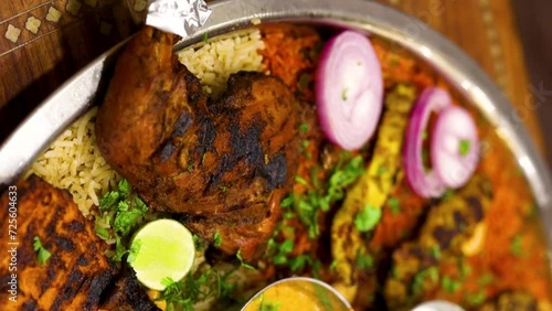 Arabian dish Mandi with chicken biryani gravy & other spices photo