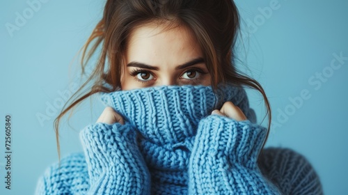 young woman in blue turtleneck sweater in cold winter days photo