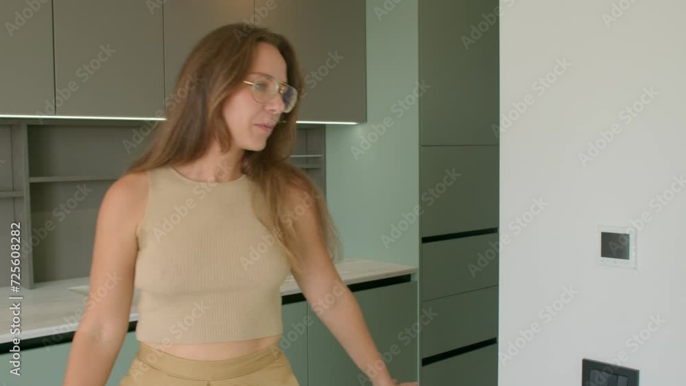 Professional woman specializing in design and architecture talking, pointing her hand at the interior details. 14.10.2023 Becici, Montenegro Professional woman specializing in design and architecture talking, pointing her hand at the interior details. 14.10.2023 Becici, Montenegro