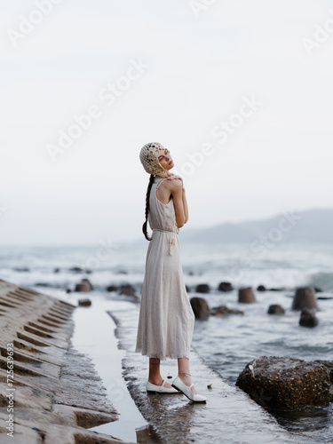 Serene Summer: A Carefree Woman Enjoying a Romantic Sunset Stroll on a Tropical Beach