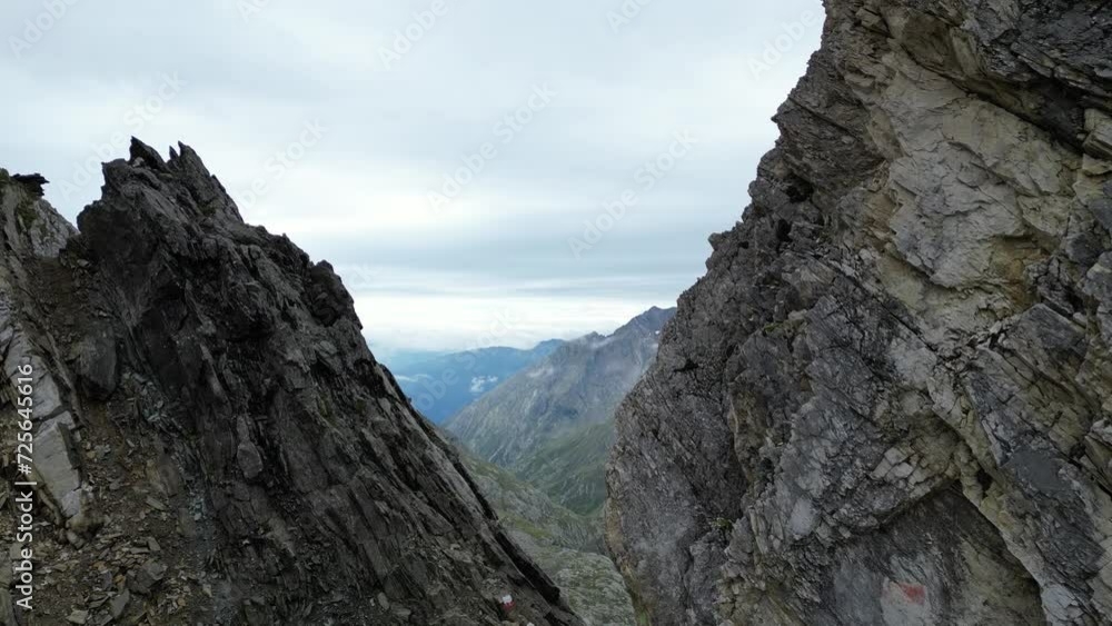 Drone flight through col Johannesscharte (Forcella Giovanni) towards mountain panorama in Texel group, South Tyrol, Italy