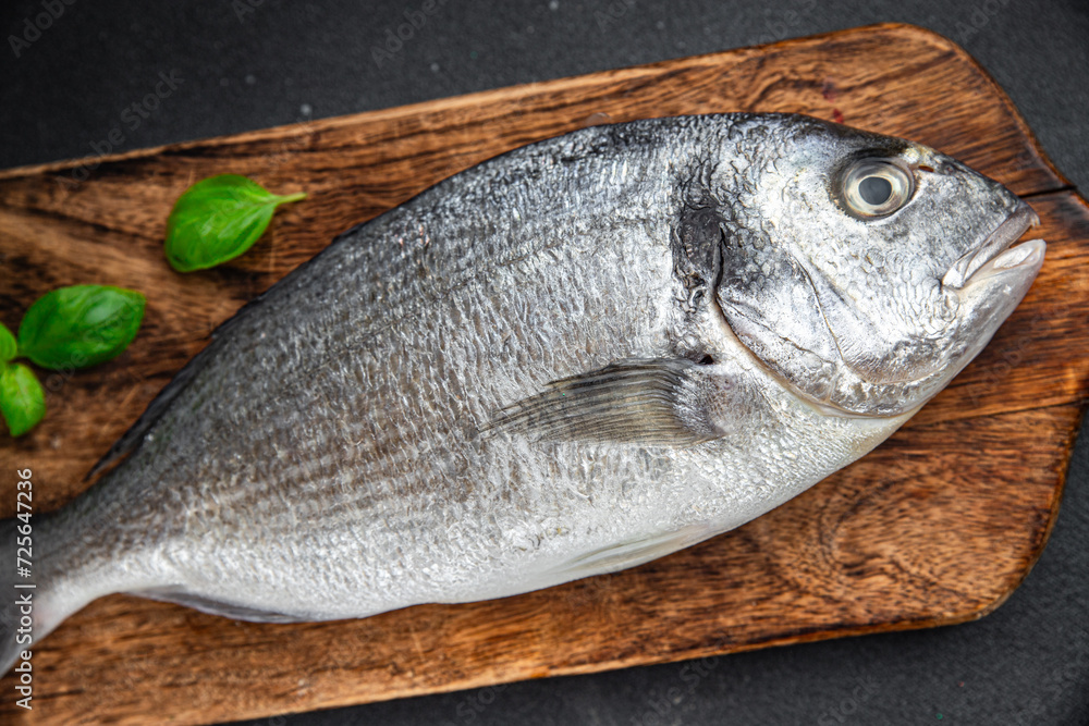 sea bream fish raw seafood tasty fresh healthy eating cooking appetizer meal food snack on the table copy space food background rustic keto or paleo diet Pescetarian sea bream fish raw seafood tasty fresh healthy eating cooking appetizer meal food snack on the table copy space food background rustic keto or paleo diet Pescetarian