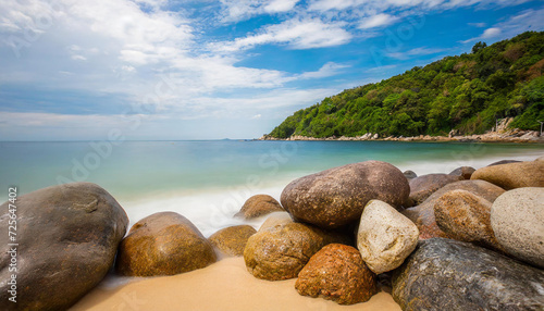 Landscape with sea shore, stones on the sand beach.