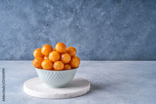 Traditional middle eastern fried sweets lokma, awameh, luqaimat. Ramadan dessert . Closeup photo