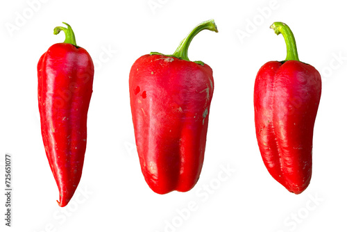 unwashed red peppers on a white background