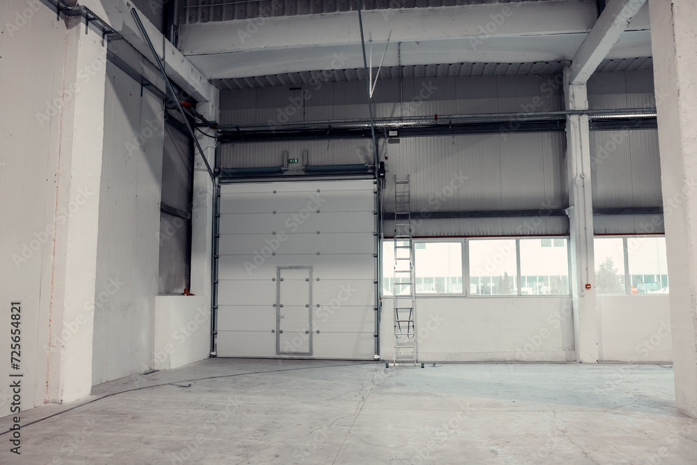 Roller door in a warehouse or factory. Industrial interior