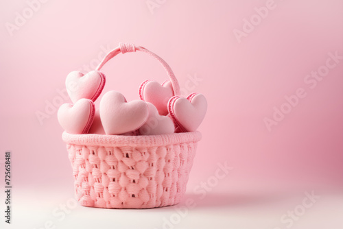Close-up of a pink woven basket filled with soft, heart-shaped marshmallows. Ideal for Valentines Day or romantic concepts. Plenty of copy space.