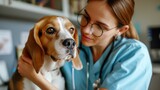 young female veterinarian lovingly cuddles a brown and white beagle. veterinary clinic for animals,