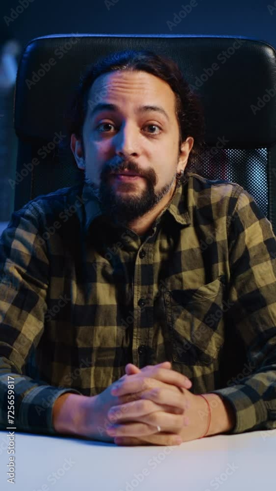 Vertical video POV of smiling man in videoconference meeting, checking up on close friend over the internet. Happy person enjoying time together with friend in online video call session while at home