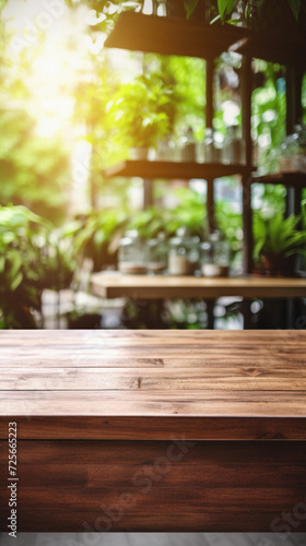Empty wooden table and Coffee shop blur background with bokeh image .